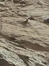 Curiosity photographs mysterious metal object on Martian rock