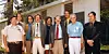Nine Voyager Imaging Team members pose outside a building, with Carl Sagan among the group.