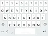 Swiftkey's main keyboard (with optional numbers row). Note that open and close parentheses are the last two entries in the first row.