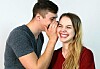 Someone whispering a secret to another