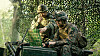 Generic photo of US Army like soldiers using a laptop in the field