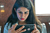 woman checks mobile phone