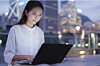 biz type on laptop against hong kong skyline