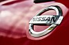 Close up of the Nissan badge on a car