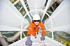Oil refinery - engineer checks fuel mix. Photo by Shutterstock