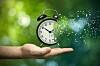 Someone holding a shattering clock
