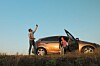 Man and woman struggling to get signal