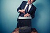 Man shreds documents. Photo by Shutterstock