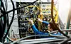 Someone in a datacenter struggling with a load of cabling