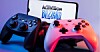 Two games controllers in front of the Blizzard Activision logo on a phone
