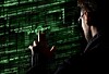 Silhouette of spy discerning password from code uses a command on graphic user interface