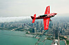 Team Oracle 8 ailerons custom built plane  flies in front of the Chicago skyline