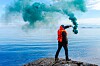 Someone using an emergency smoke torch