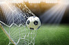 Football goes into the net/ photo by shutterstock