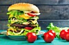 Multi-level burger too big to eat. Photo by Shutterstock