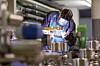 Worker welds at manufacturing plant. Phto by Shutterstock