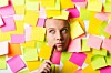 woman surrounded by sticky notes