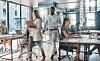 Generic busy office scene of workers and PCs