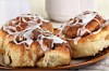 three cinnamon danishes on a plate