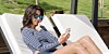 Woman gets bad news about roaming charge on her mobile phone cellphone