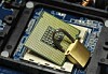 An unlocked padlock on a chip, hint hint