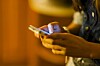 Smartphone user photo via Shutterstock