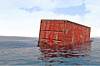 lost shipping container bobs about in the ocean