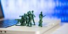 Toy soldiers defend laptop