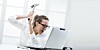 Woman poised to smash laptop with hammer