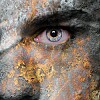 A close-up of a rust-textured face