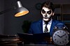 man dressed as zombie doing accounts/audit
