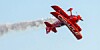 Oracle plane upside down trailing a cloud