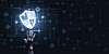 Illustration of someone reaching out and touching a shield representing cybersecurity
