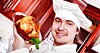 chef presents a roast chicken in pomegranate sauce. Photo by Shutterstock