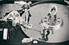 Workers on hard drive platter