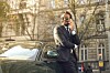 guy in suit talks on phone outside office