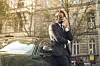 guy in suit talks on phone outside office