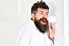 Hipster in bathrobe listens in on a conversation