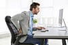 man in pain at workstation