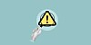 Caution sign in magnifying glass