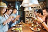 Millennials snap pics of their food with smartphones for Facebook/Twitter/instagram. Photo by shutterstock