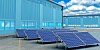 Solar panels next to industrial building