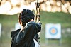 An archer aims at a target