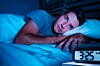 Stressed dude awake at night
