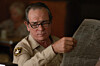 Tommy Lee Jones delivers implied facepalm. From No Country for Old Men  Copyright Miramax Pictures. 2007.