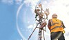 Someone standing by some 5G towers