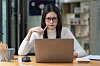 shutterstock Concerned female worker looking at laptop screen