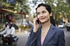 Woman in city street using smartphone