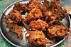 A silver patter of fried onion bhajis