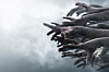 bloodied hands reach out into the fog/cloud